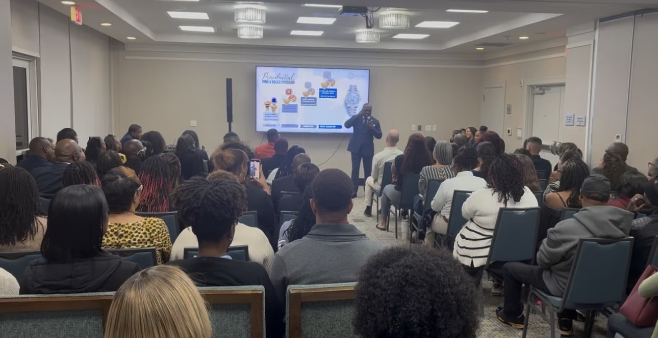 Pastor Mark Cleveland speaking to a full room at a Freedom Outreach conference